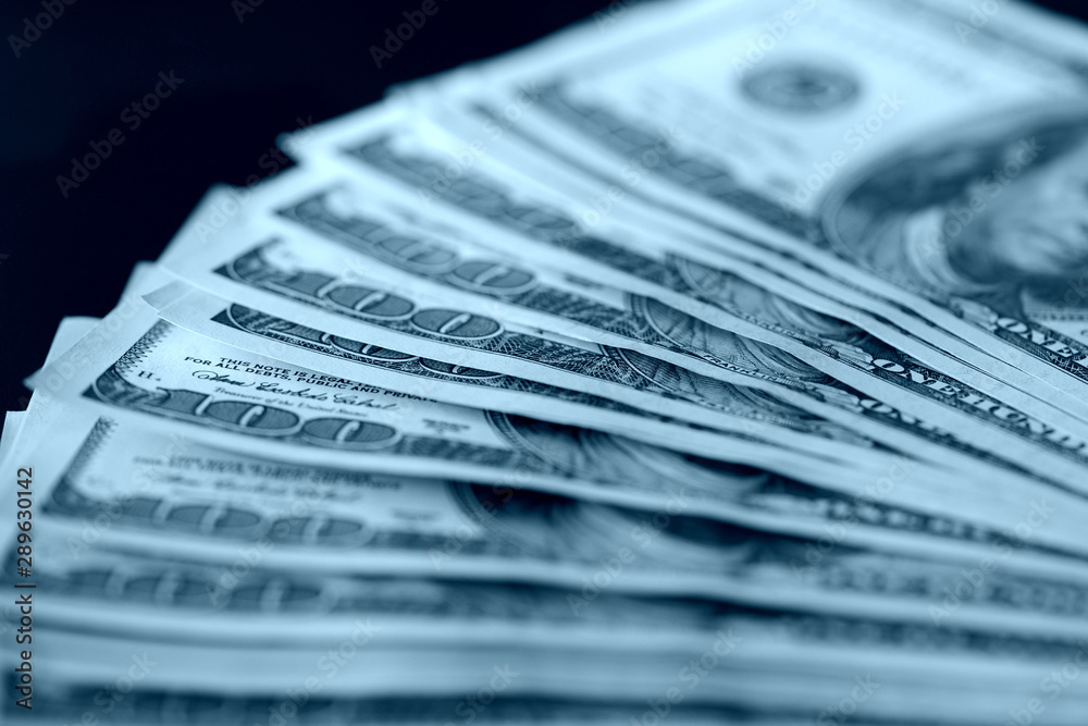 Hundred dollar bills close up blue color toned. Money background Hundred dollar bills close up blue color toned. Money background