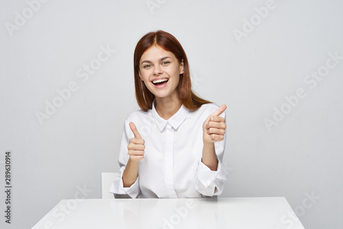 business woman sitting at desk with laptop