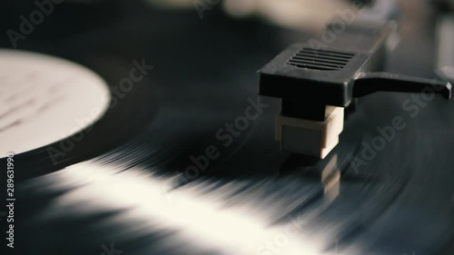 Turntable needle drop on a vinyl record to playing