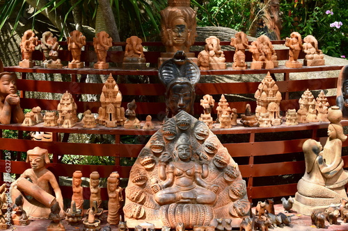 Hindu idols. Many different figures-gods from clay. The deities are placed on a stand.