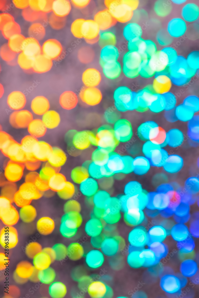 Colorful prism confetti blurred festive backdrop, trendy sparkles and glitter background, flat lay style. Christmas and holidays concept Colorful prism confetti blurred festive backdrop, trendy sparkles and glitter background, flat lay style. Christmas and holidays concept
