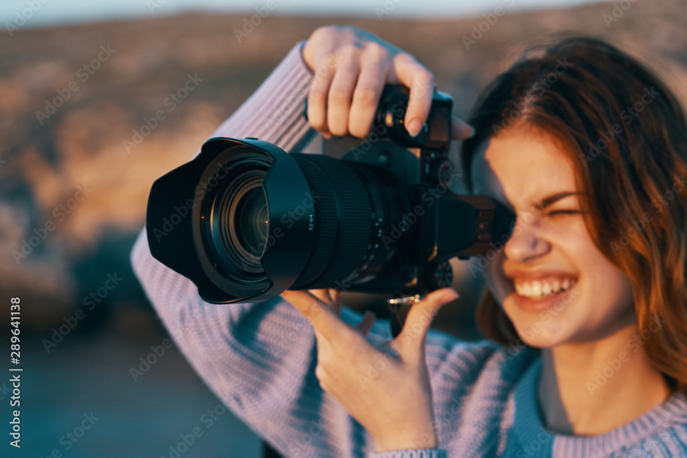 woman taking photo with digital camera