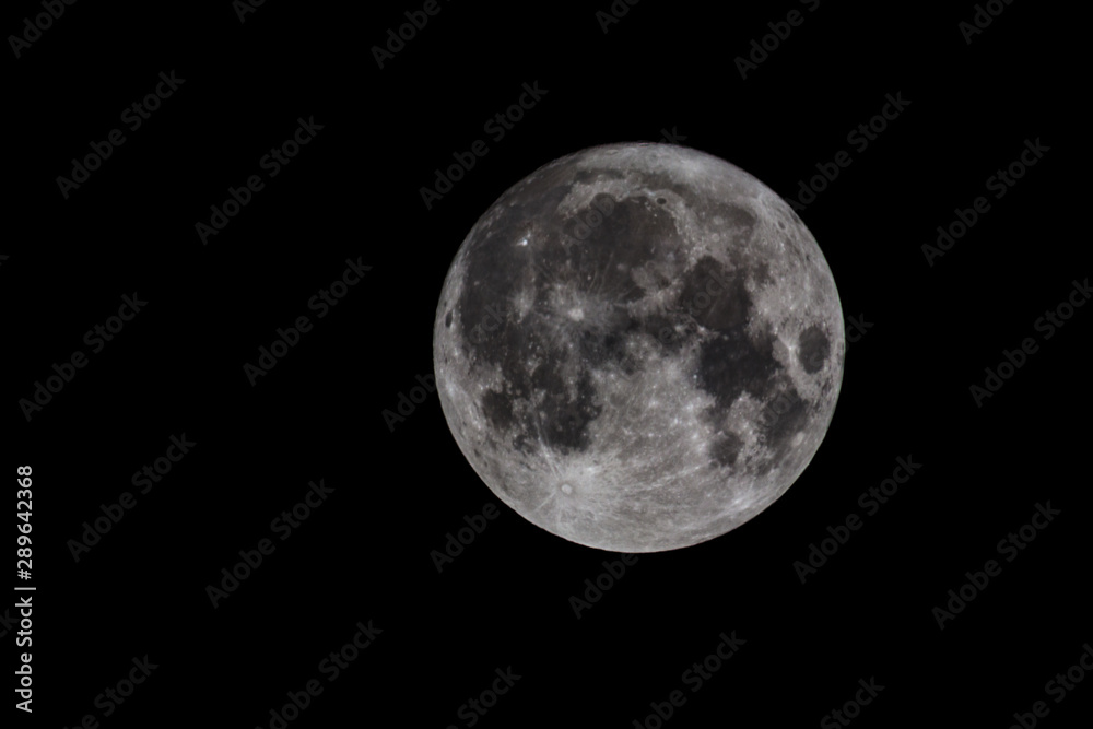 Obraz premium Full moon. Night closeup isolated on dark background. Supermoon astronomy telescope scene with space. Lunar surface texture bright and glow. Abstract celestial planet with crater at nighttime