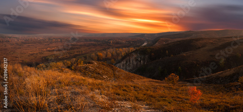 Autumn hills and bright morning sky