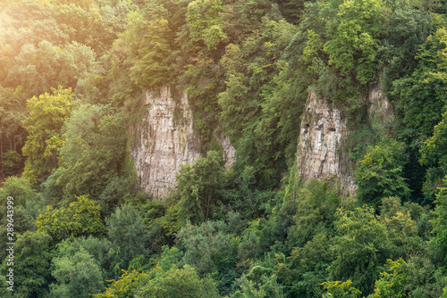 Beautiful Summer evening landscape image of Symonds Yat Rock in English countryside during evening light