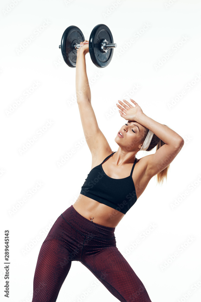 Fototapeta premium woman exercising with dumbbells