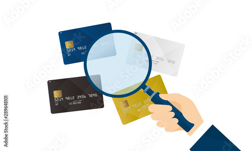 いろいろなクレジットカードと虫眼鏡