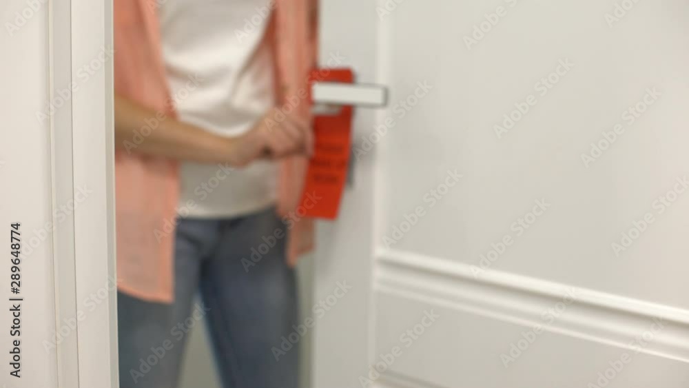 Female hanging sign on doorknob Please make up room, hotel cleaning services Female hanging sign on doorknob Please make up room, hotel cleaning services