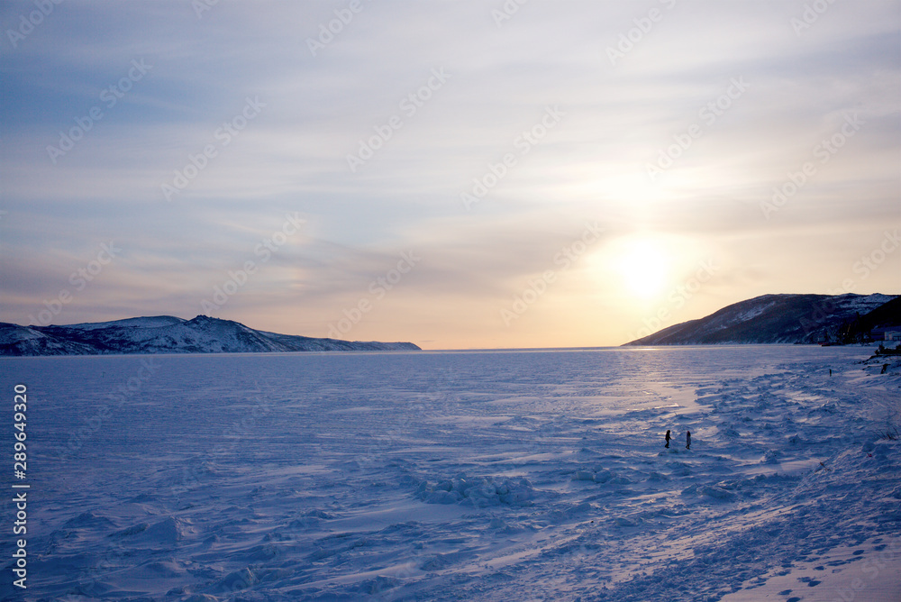 People walking on the ice floe at winter, Magadan, Siberia, Russia.