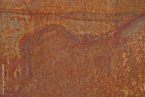 red background of a piece of rusty metal