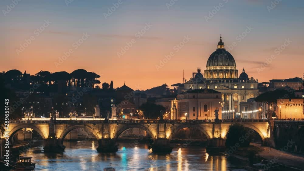 Rome, Italy. Papal Basilica Of St. Peter In The Vatican And Aelian Bridge In Evening Night Illuminations. Day To NIght Time Lapse. Sunset Time. Rome, Italy. Papal Basilica Of St. Peter In The Vatican And Aelian Bridge In Evening Night Illuminations. Day To NIght Time Lapse. Sunset Time.
