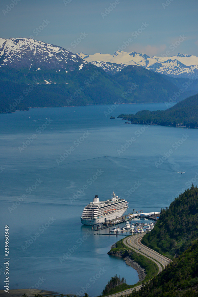 A landscape of a cruise ship in the fjord in Alaska A landscape of a cruise ship in the fjord in Alaska