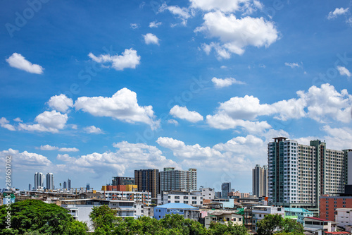 Cityscape of residential buildings and condominiums on beautiful blue sky and white clouds day