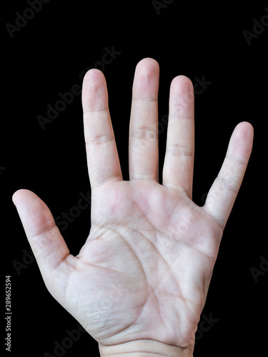 Male left hand palm with black background photo