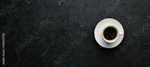 Foto Cup of coffee on the table. Top view. Free space for your text.