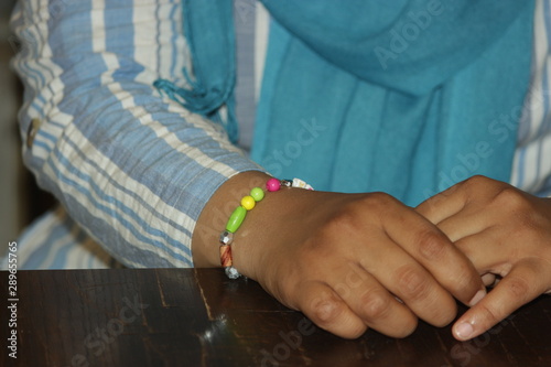 hands of woman wearing bracelets