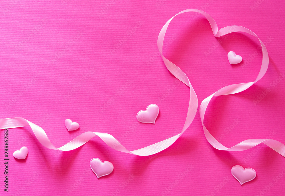 Decorative design for Valentine's Day. Hearts and ribbon on a pink-red background