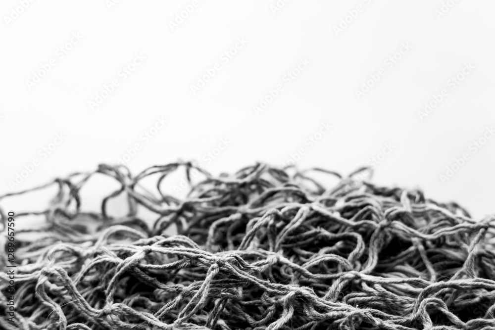 The texture of the old fishing net. Monochrome image with place for text. The texture of the old fishing net. Monochrome image with place for text.
