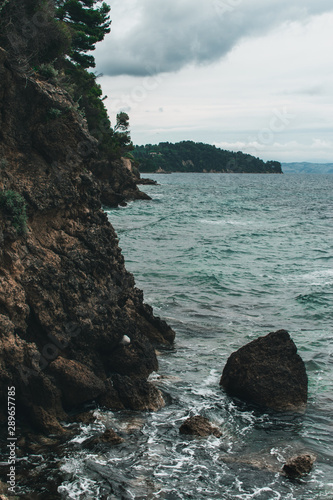 Vocation in Greece, Corfu. Water, cliff, mountains, and beautiful summer evening 
