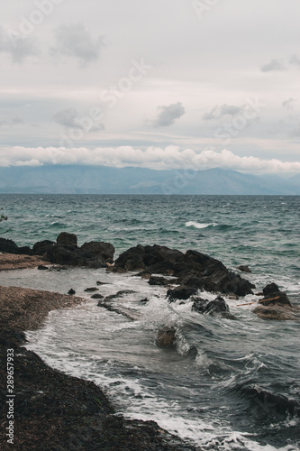 Vocation in Greece, Corfu. Water, cliff, mountains, and beautiful summer evening 