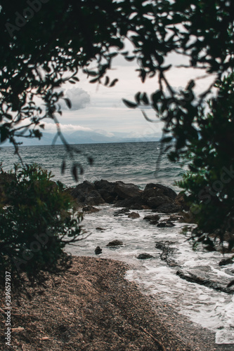 Vocation in Greece, Corfu. Water, cliff, mountains, and beautiful summer evening 