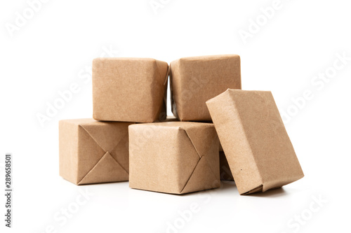 Online shopping and delivery concept. Bunch of express delivery carton boxes. Mini cardboard boxes. Parcel boxes with craft paper.