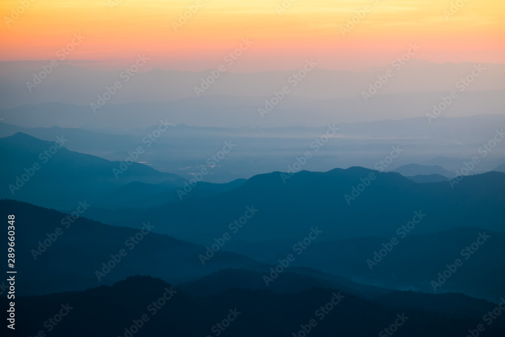 Dramatic sunset and sunrise over mountain morning twilight evening sky.