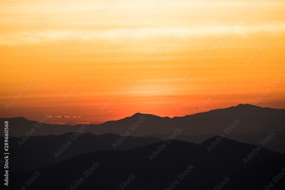 Dramatic sunset and sunrise over mountain morning twilight over evening sky horizon. Dramatic sunset and sunrise over mountain morning twilight over evening sky horizon.