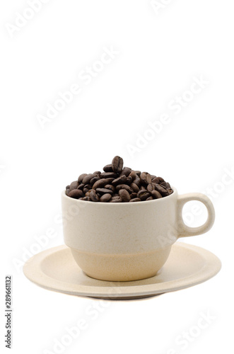 Coffee beans in a porcelain cup isolated on white background