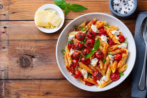 Canvas Print Pasta penne with roasted tomato, sauce, mozzarella cheese