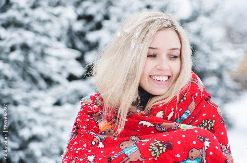 Smiling beautiful woman has fun outdoors with snow. Christmas Holidays. Smiling beautiful woman has fun outdoors with snow. Christmas Holidays.