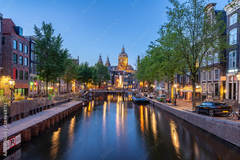 Saint Nicholas Church at night in Amsterdam city, Netherlands
