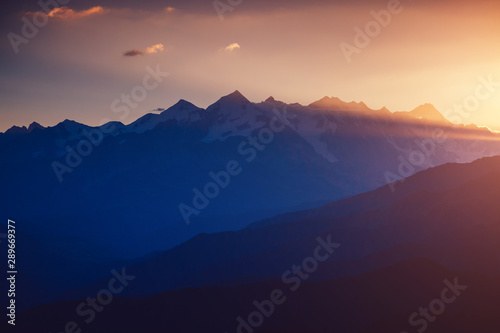 A look at the grand ridge at twilight. Location Upper Svaneti, Georgia country, Europe. Main Caucasian ridge.