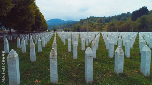 Slika na platnu SREBRENICA, Potocari, Bosnia and Herzegovina Flying above the graves of murdered