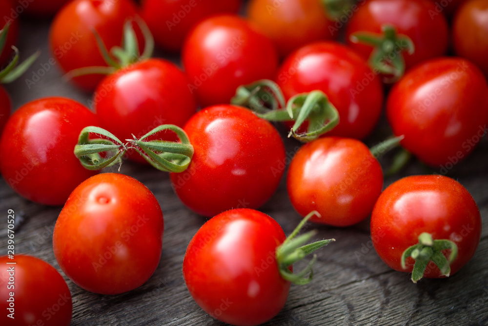 Cherry tomatoes on a wooden table Cherry tomatoes on a wooden table