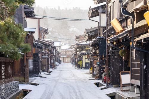 Takayama old town with snow falling in Gifu, Japan