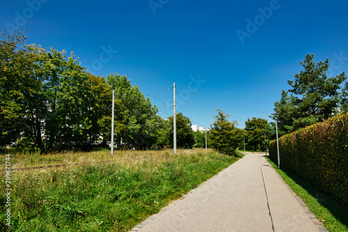 Wallpaper Mural Footpath along a tram route, next to a residential area in Munich, Schwabing, Bavaria Torontodigital.ca