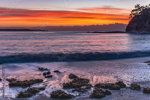 Fototapeta Naklejka Na Ścianę i Meble -  Colourful Streaky Clouds Sunrise Seascape