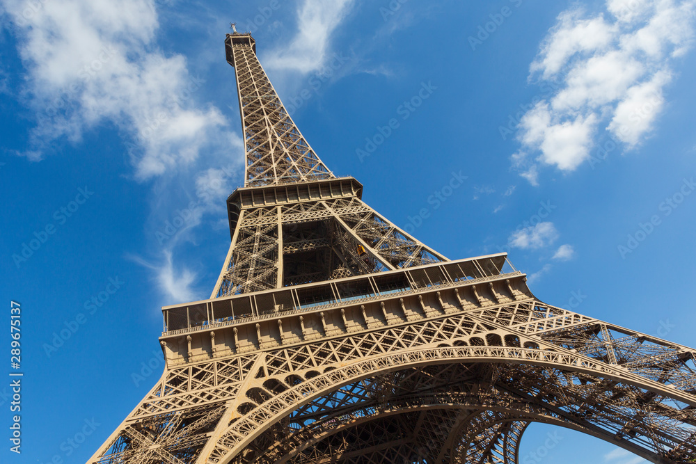 The Eiffel Tower, a wrought-iron lattice tower on the Champ de Mars in Paris, France - obrazy, fototapety, plakaty 