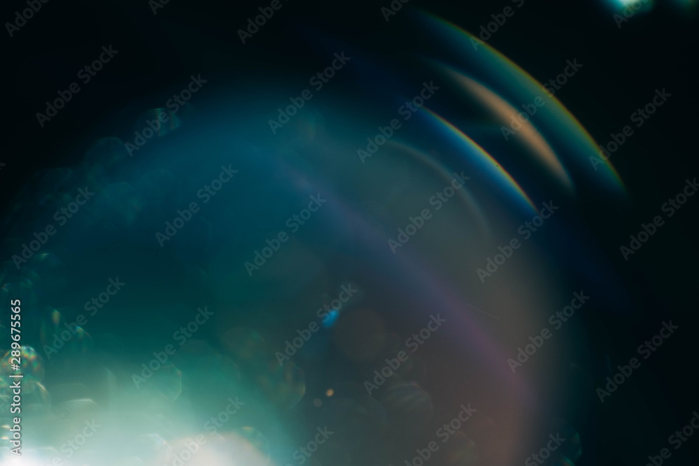 Blur multicolor lens flare glow. Teal blue abstract art background. Galaxy design.
