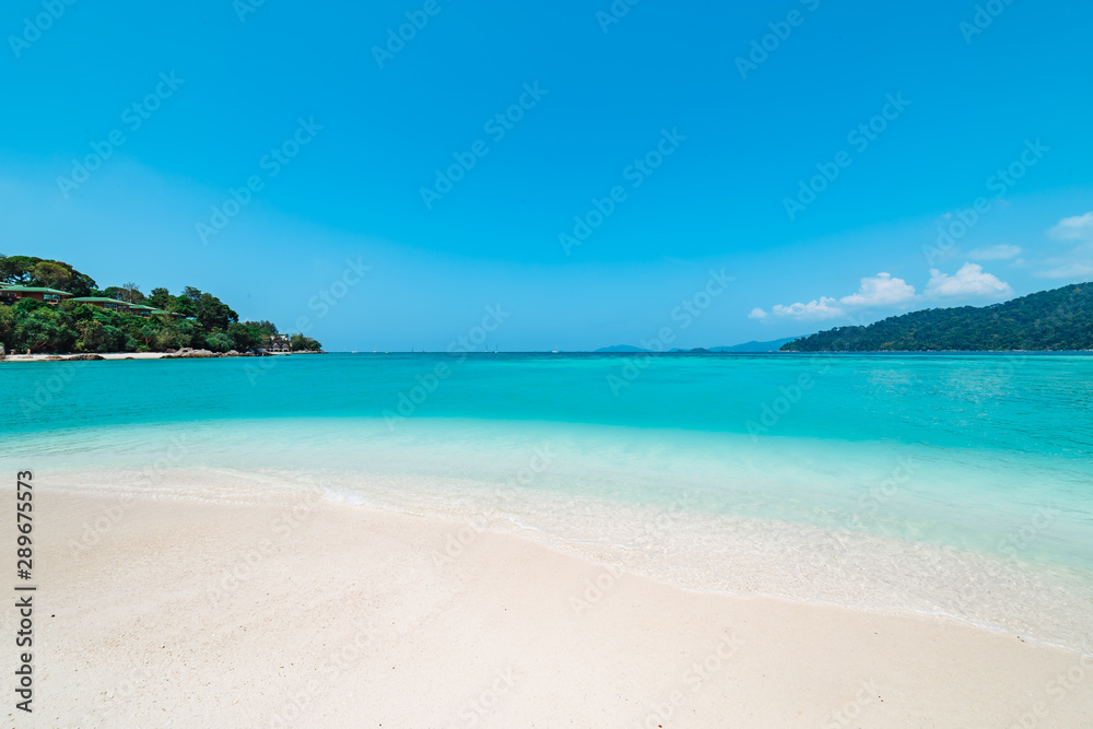 Pristine white beach with azure blue ocean