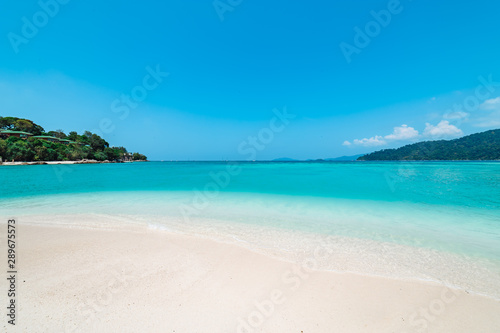 Pristine white beach with azure blue ocean © ibreakstock