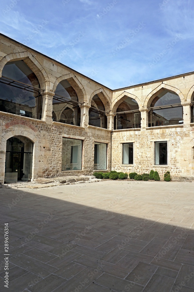 View of the courtyard of famous historical Deveci Han building in Edirne, Turkey.