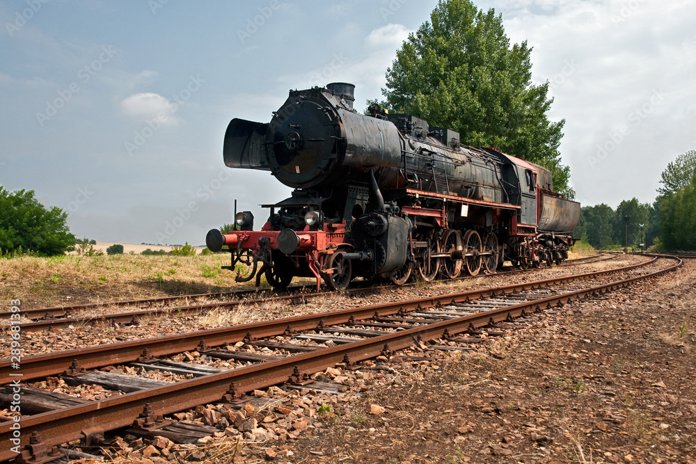 steam locomotive waiting for signal to start moving