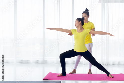 Yoga teachers are teaching exercise yoga for students. With the correct position Inside the room for good health and flexibility of the muscles with a feeling of happiness. It is a lifestyle activity 
