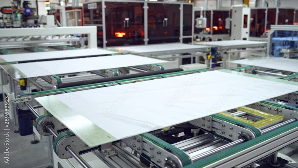 Automated manufacturing process of solar panels. Innovated technology for making solar cells in a robotic factory background. Automated manufacturing process of solar panels. Innovated technology for making solar cells in a robotic factory background.