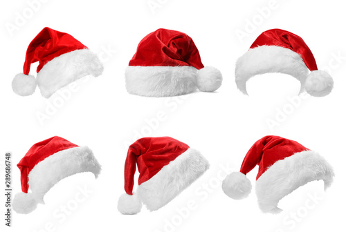 Set of red Santa Claus hats on white background