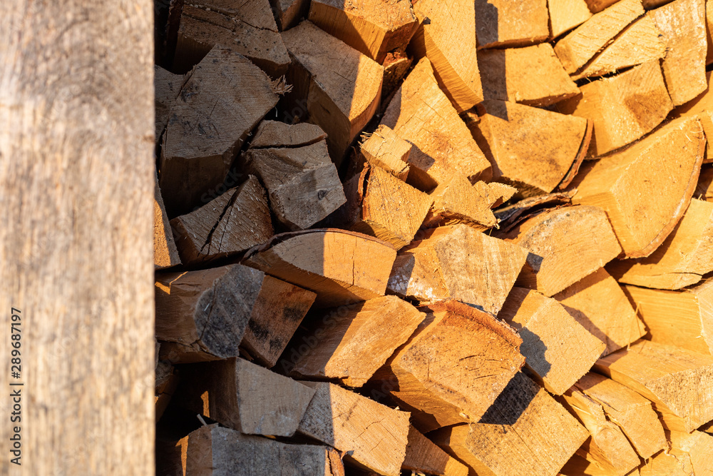 Firewood background at sunset, rural concept Firewood background at sunset, rural concept