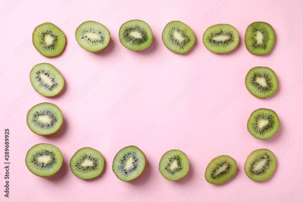 Frame made of fresh kiwis on pink background, top view. Space for text Frame made of fresh kiwis on pink background, top view. Space for text