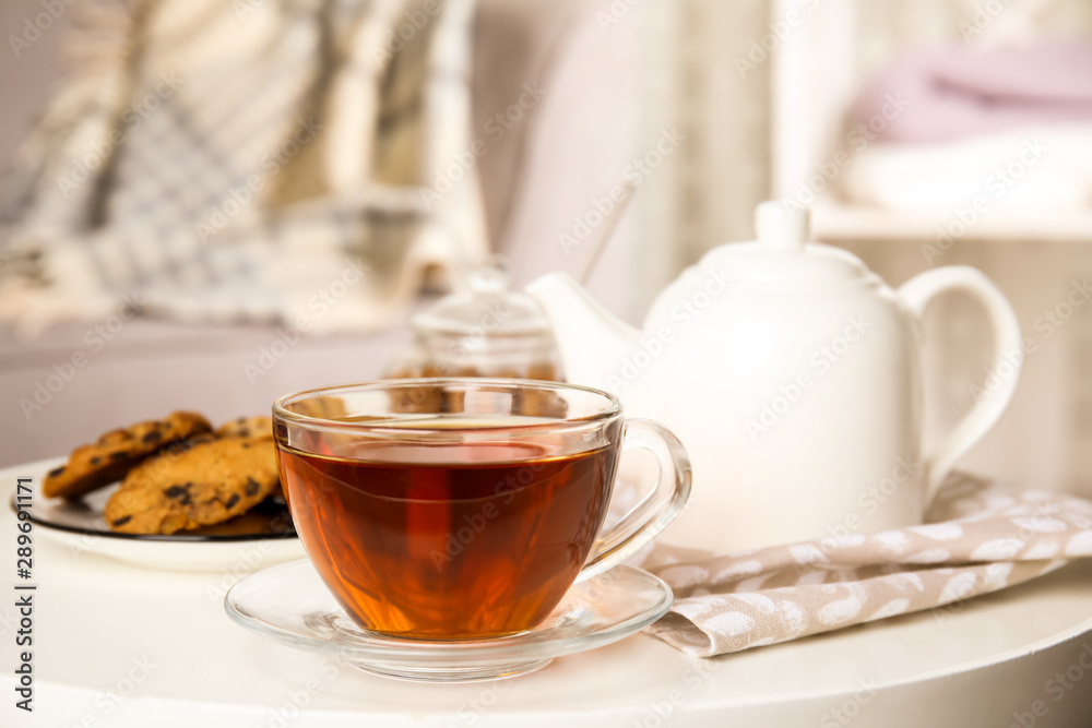 Cup of hot tea on white table indoors. Winter drink Cup of hot tea on white table indoors. Winter drink